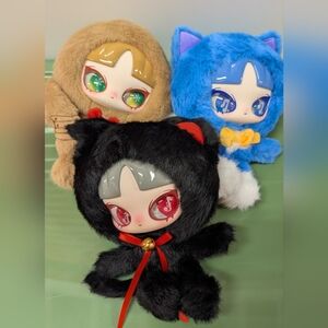 Cute Plush Dolls in Black, Blue, and Brown